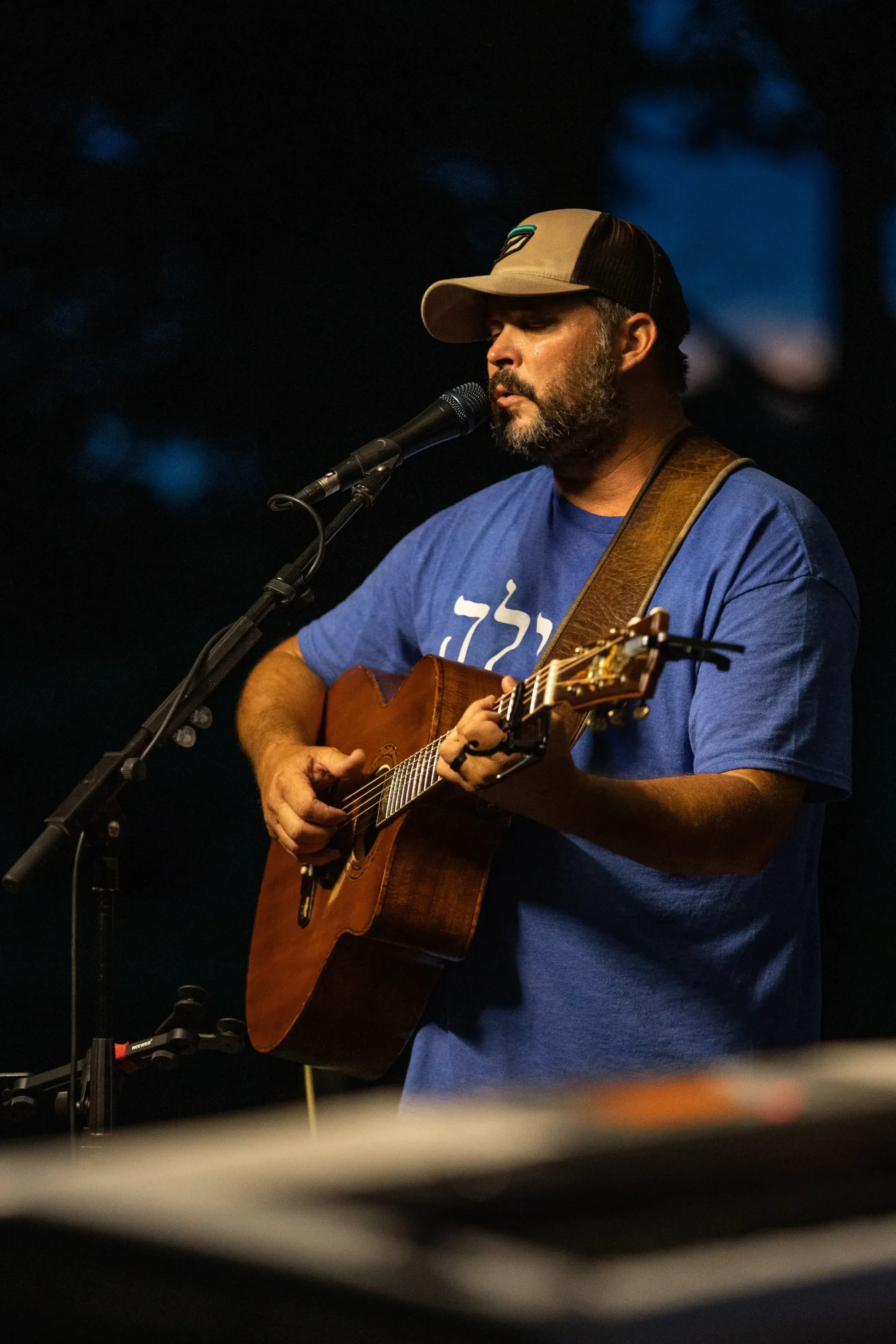 Robby Cummings playing guitar at night at Proclaim 2021